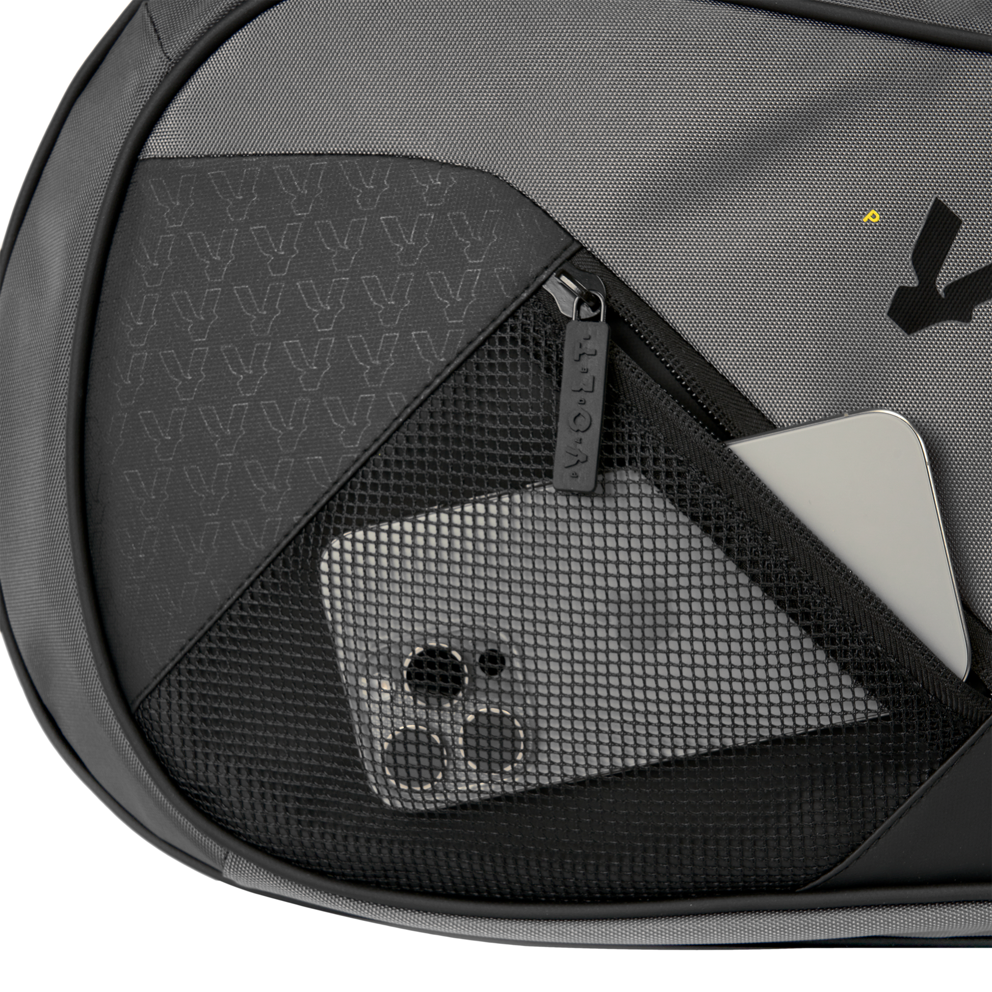 Close-up of Volt’s grey XL padel bag showing a black mesh pocket with a smartphone and a silver laptop inside.