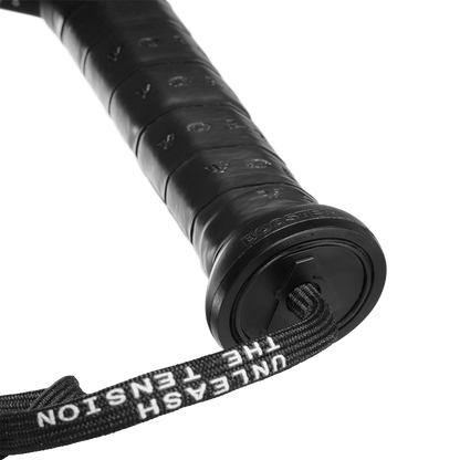 Close-up of the Booster cap on a racket handle, with the Booster engraving visible and a stcap with the text Unleash The Tension.