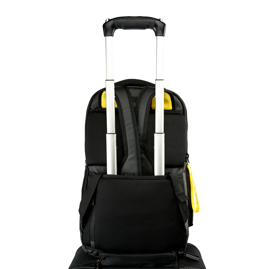 Back view of the Volt backpack with a trolley strap attached