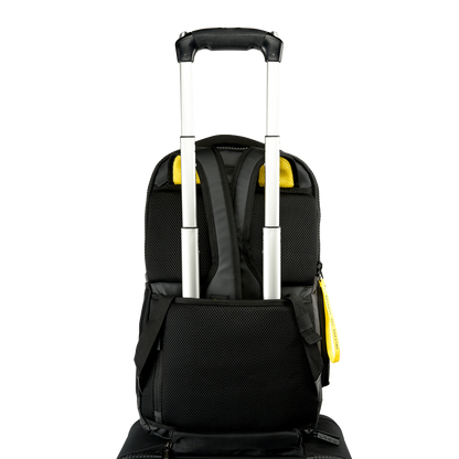 Back view of the Volt backpack with a trolley strap attached