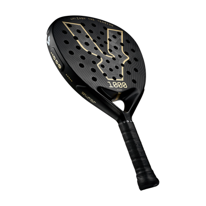 Angle view of the Volt 1000 V5 padel racket, showcasing its classy black and metallic gold design with its 24K Silver Aluminized Carbon pattern inside the big logo.