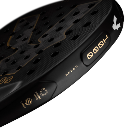 Top detail of the Volt 1000 V5 padel racket, showcasing the flashy gold Volt logo and the metallic gold details on the side