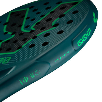 Side detail of the Volt 500 V5 padel racket, showcasing the vibrant green and fluor green 500 letters and other details, with its 3K Tweel carbon pattern inside the big logo.
