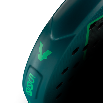 Side detail of the Volt 500 V5 padel racket, showcasing the vibrant green and fluor green V logo and highlighting the racket shape details on the side.