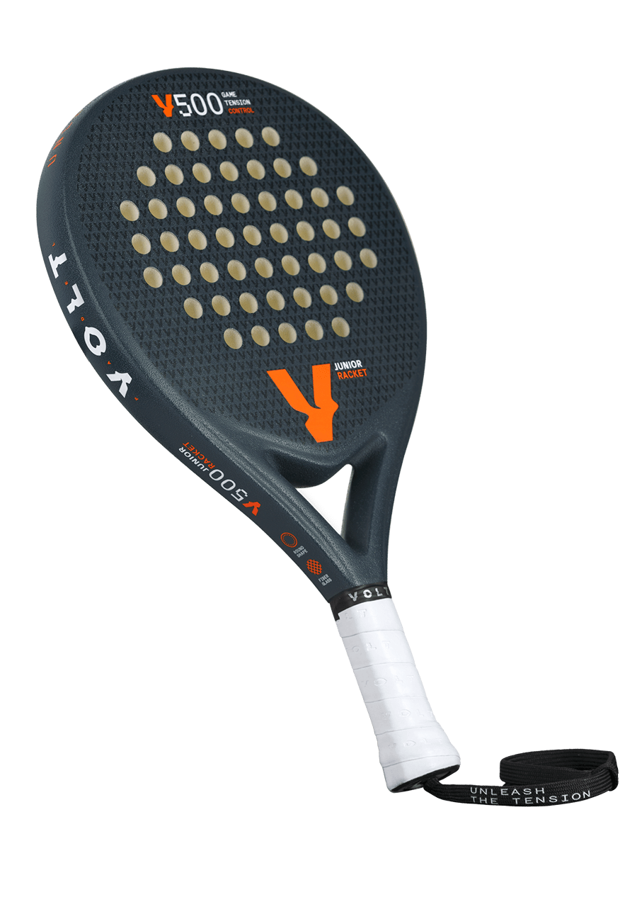 Angled view of the Volt 500 Junior V4 padel racket, featuring its black textured surface and perforations designed for juniors.