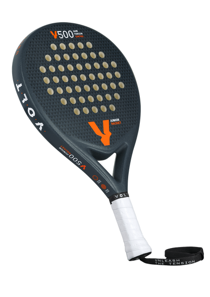 Angled view of the Volt 500 Junior V4 padel racket, featuring its black textured surface and perforations designed for juniors.