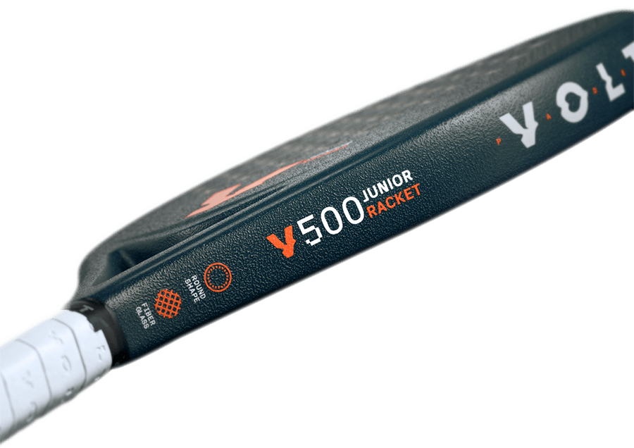 Side detail of the Volt 500 Junior V4 padel racket, showcasing the branding, 'Round Shape' icon, and fiberglass material label in orange and white.