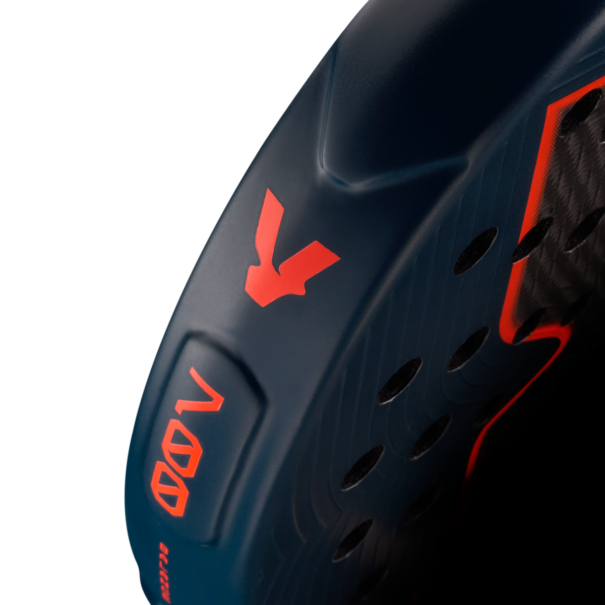Side detail of the Volt 700 V5 padel racket, showcasing the beautiful dark blue and fluor orange V logo and highlighting the racket shape details on the side.