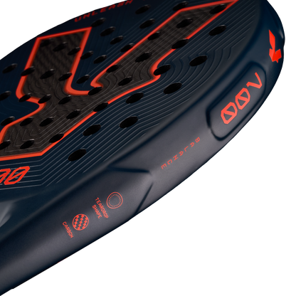 Side detail of the Volt 700 V5 padel racket, showcasing the its beautiful dark blue and fluor orange 700 letters and other details, with its 3K Tweel carbon pattern inside the big logo.