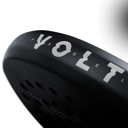 Side detail view of the Volt 800 V4 padel racket, highlighting its 'Round Shape' label and carbon construction.