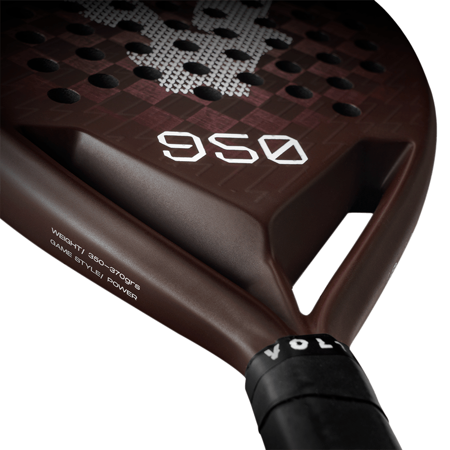 Close-up of the Volt 950 V4 padel racket's lower face, featuring the weight specifications and sleek brown carbon finish.